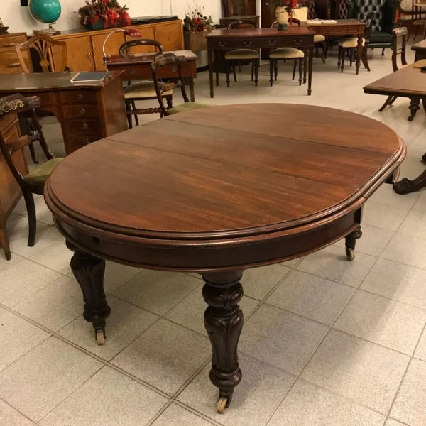 Antico tavolo tondo allungabile in mogano
